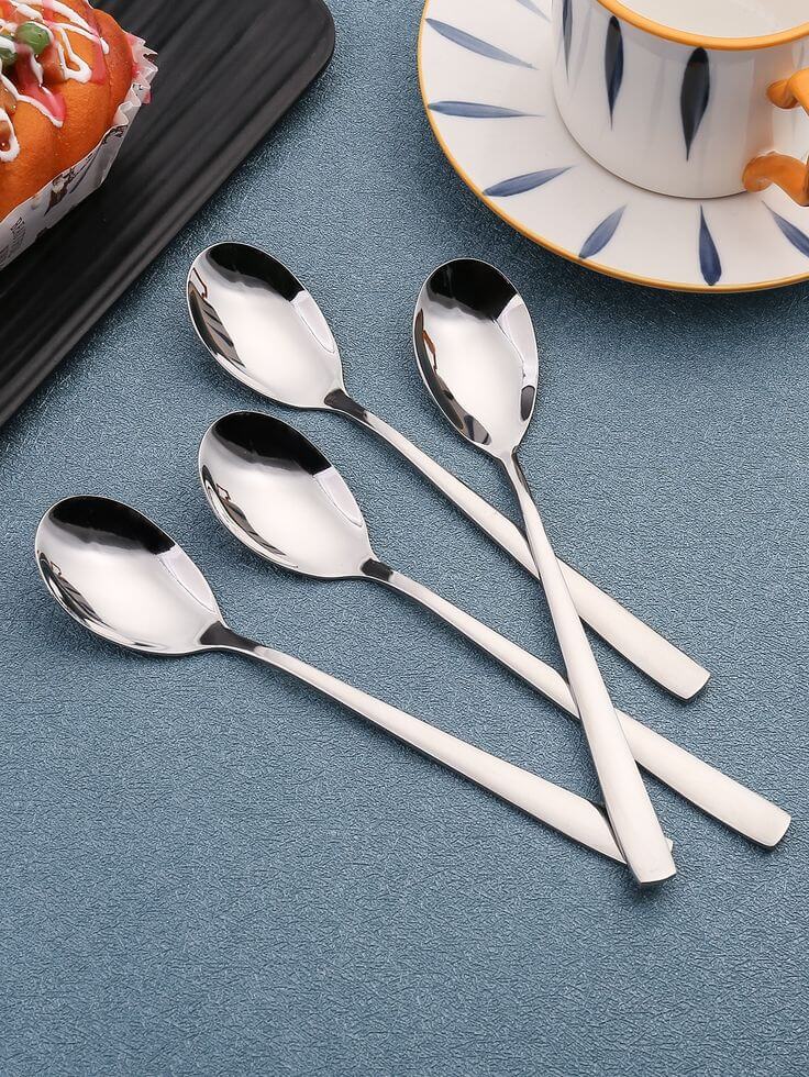 Polished silver and gold spoon