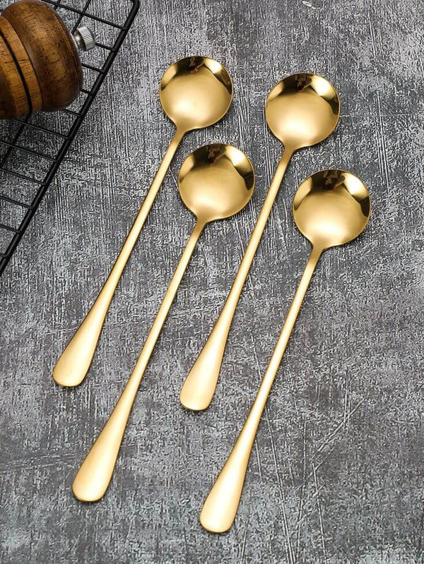 Polished silver and gold spoon