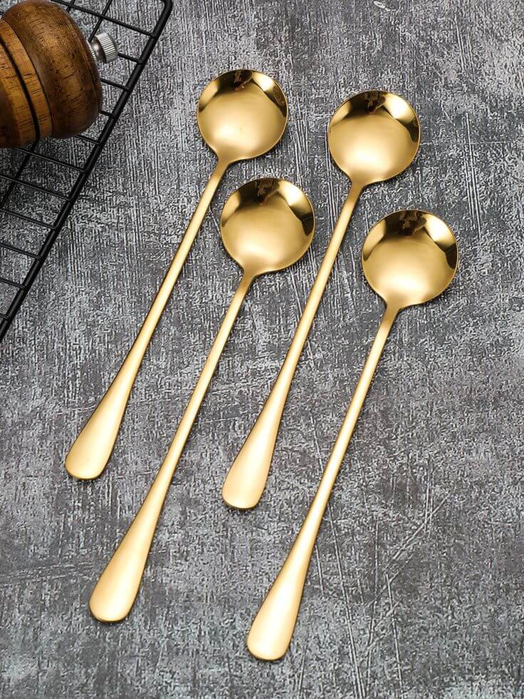 Polished silver and gold spoon