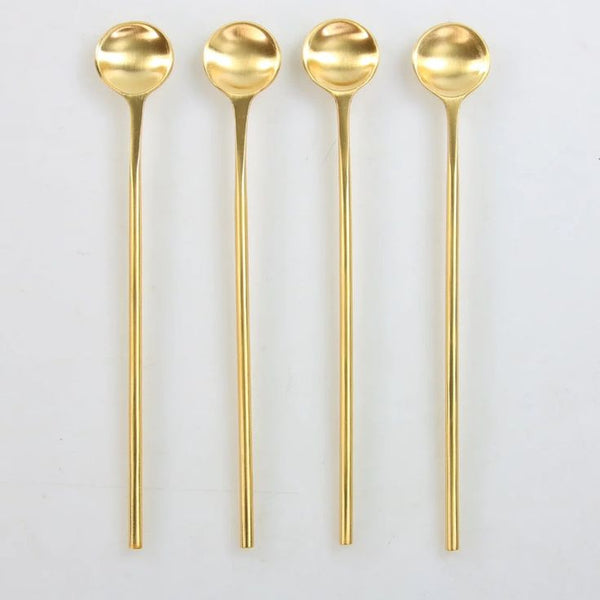 Polished silver and gold spoon