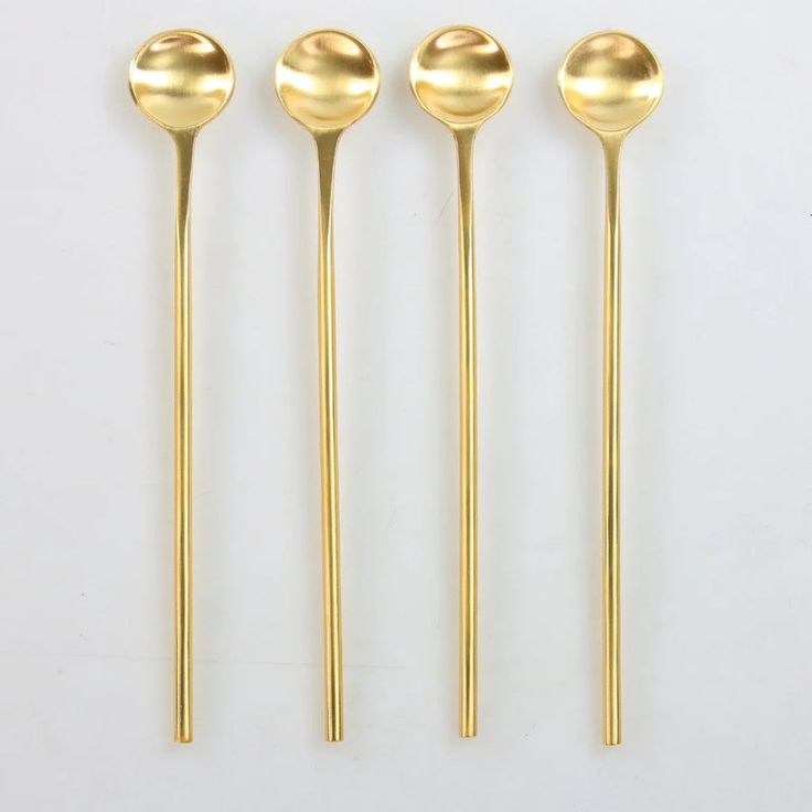 Polished silver and gold spoon